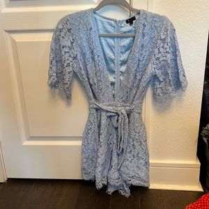 NEVER WORN. NBD BABY BLUE LACE ROMPER. Size SMALL.